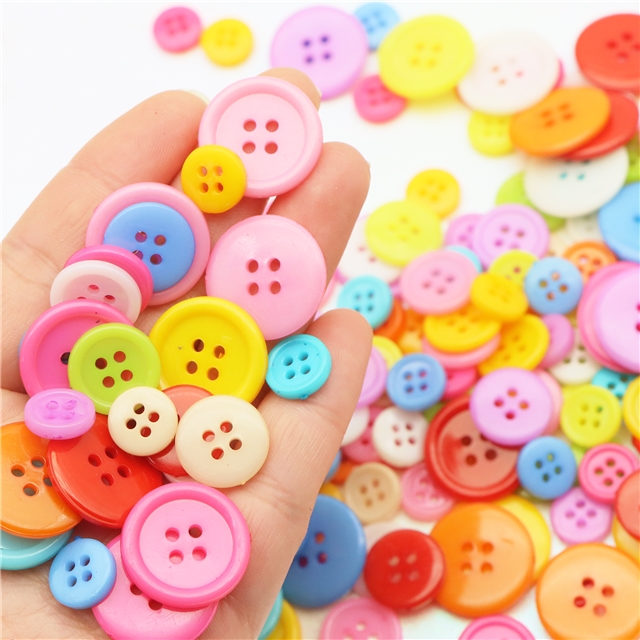 Plastic Plastic colored four eye button round