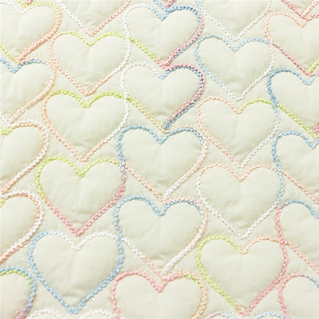 embroidered heart quilted fabric