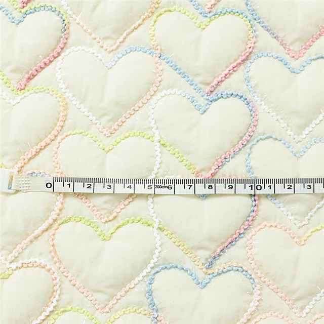 embroidered heart quilted fabric