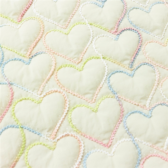 embroidered heart quilted fabric