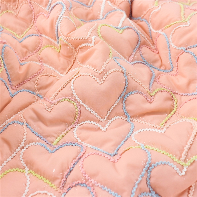 embroidered heart quilted fabric