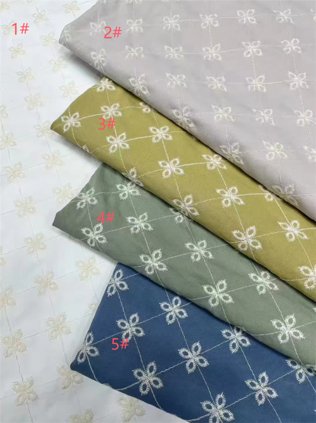 embroidered clover denim fabric
