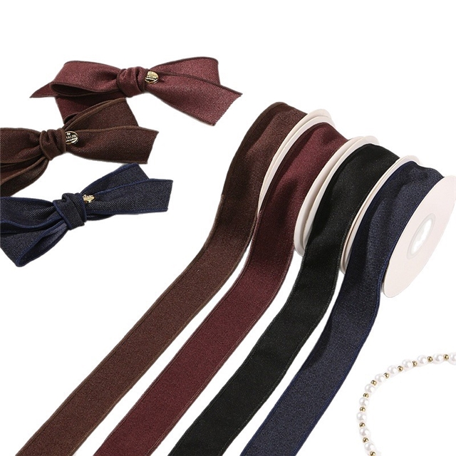 thick solid color woven tape with diagonal edge pressing