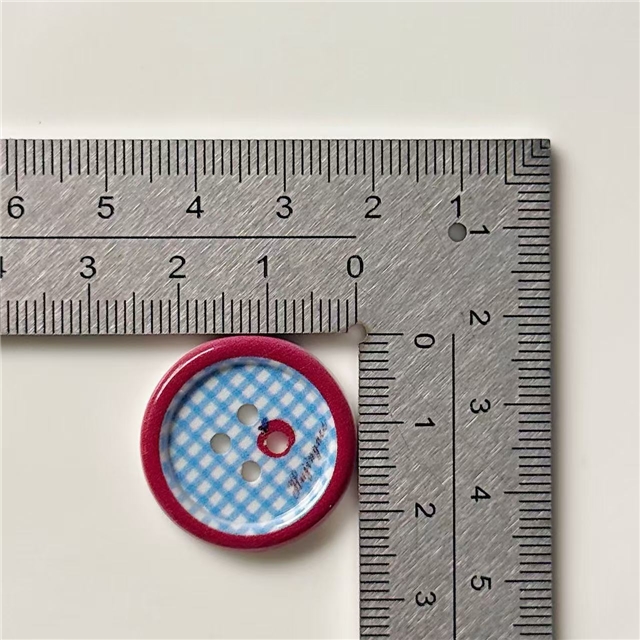 grid patterned red blue heart-shaped apple round button