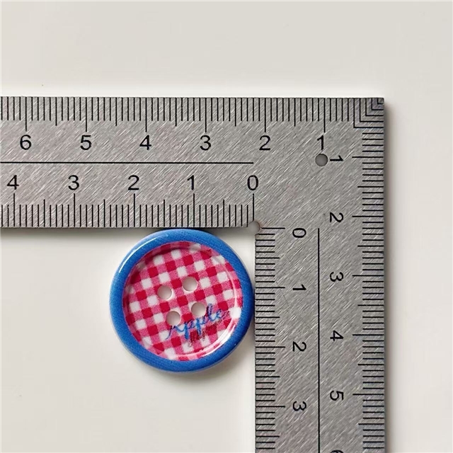 grid patterned red blue heart-shaped apple round button