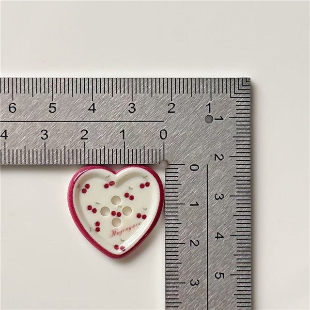 grid patterned red blue heart-shaped apple round button
