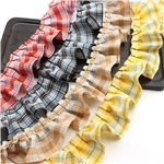 two tone checkered pleated skirt hem